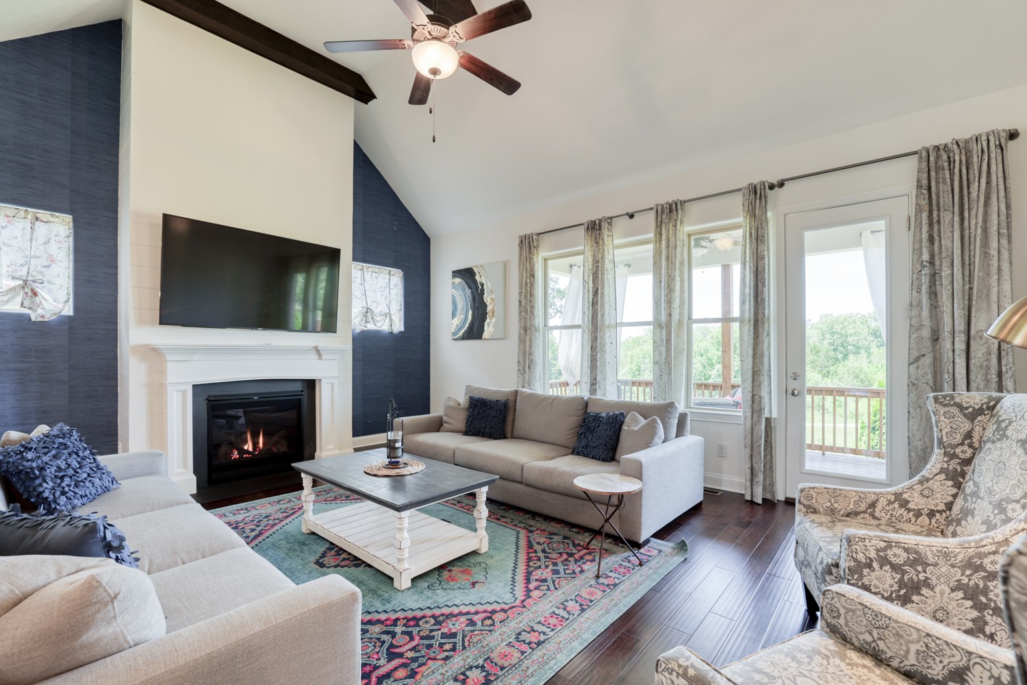 1146 Batbriar Road Murfreesboro, TN 37128 - Photo 27 of 56 a living room with furniture a fireplace and a flat screen tv