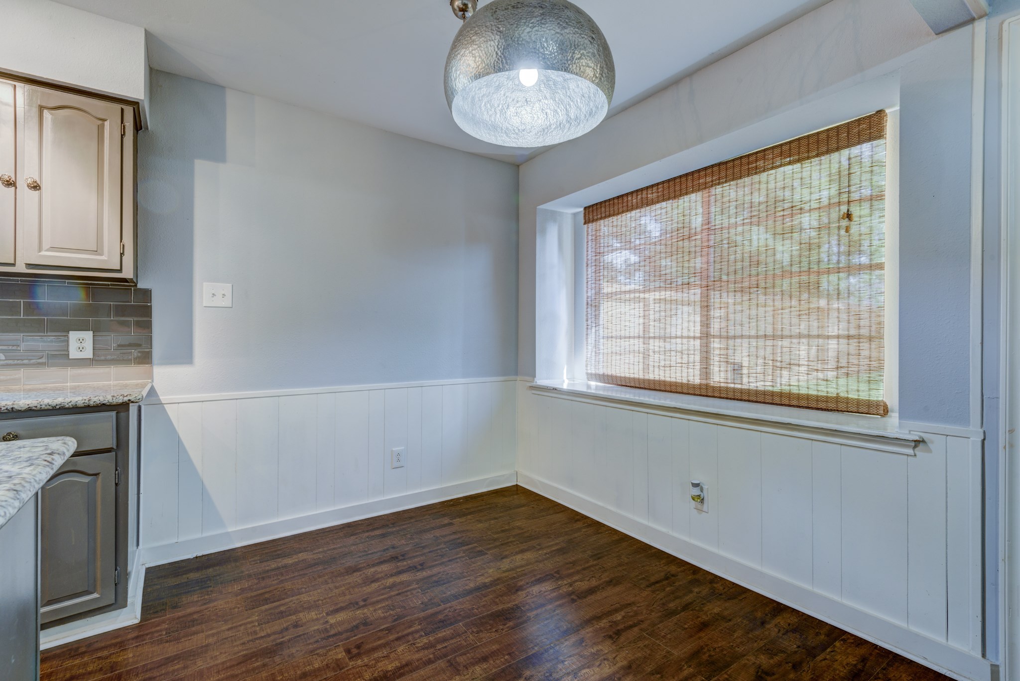 6126 Rena Street Houston, TX 77092 - Photo 11 of 24 a view of empty room with wooden floor and fan