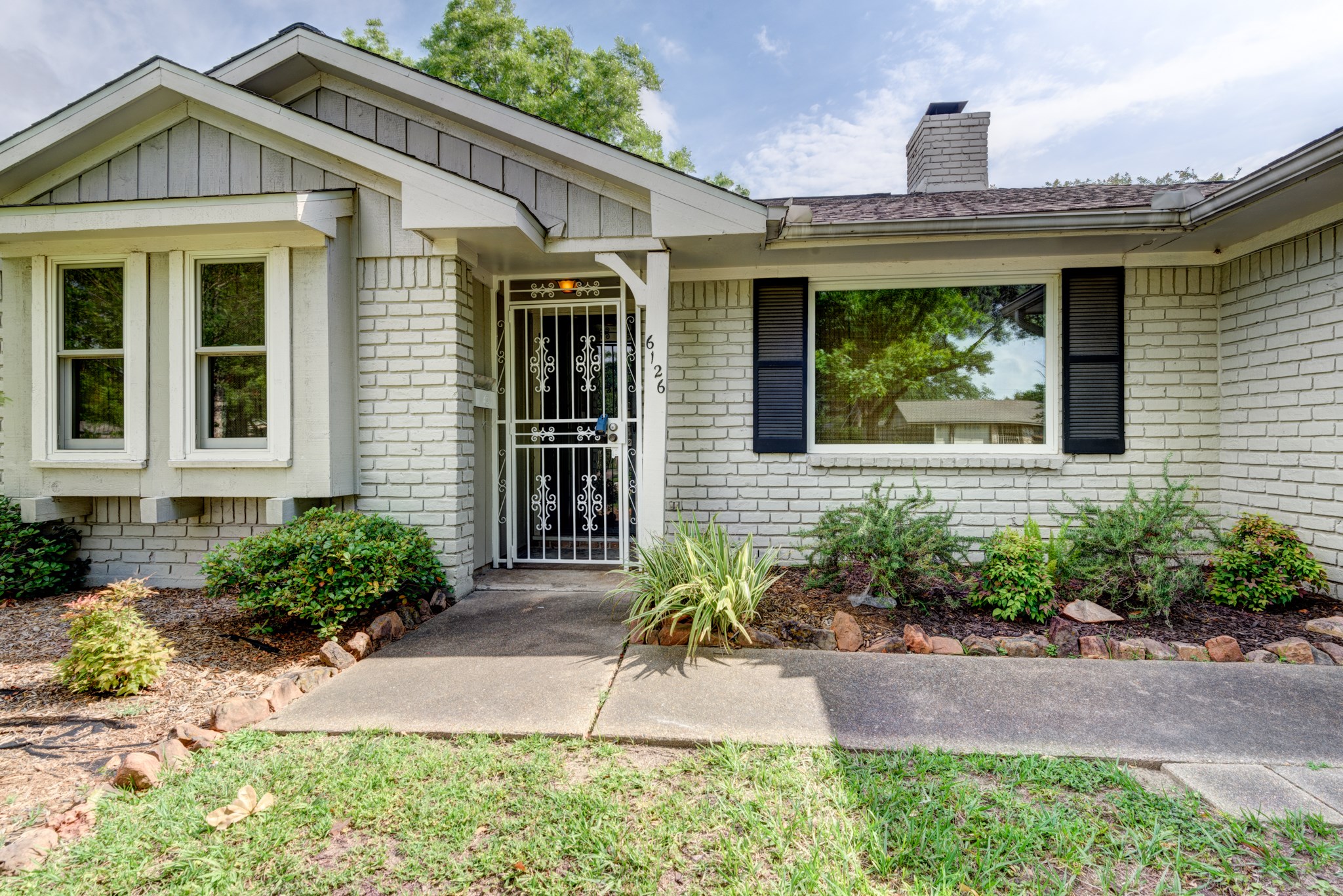 6126 Rena Street Houston, TX 77092 - Photo 3 of 24 a front view of a house with garden
