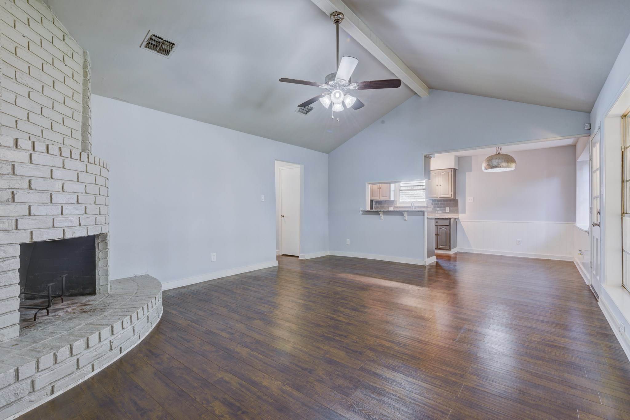 6126 Rena Street Houston, TX 77092 - Photo 10 of 24 a view of empty room with wooden floor and fireplace