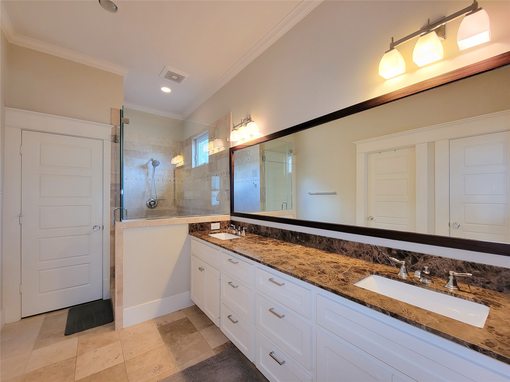 1140 West Cottage Street Houston, TX 77009 - Photo 27 of 37 a bathroom with a sink and a large mirror