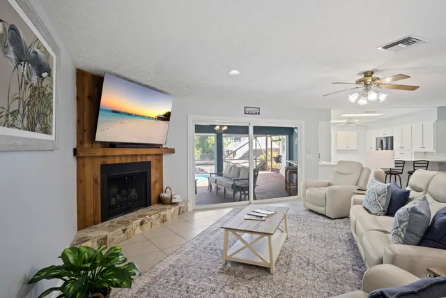 a kitchen with a sink a stove a refrigerator and white cabinets