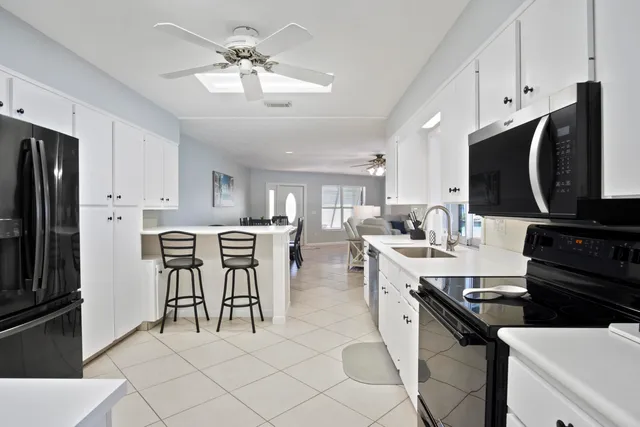 a bedroom with bed and painting on the wall