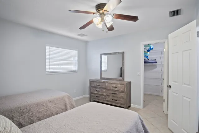 a dining room with furniture and floor to ceiling window