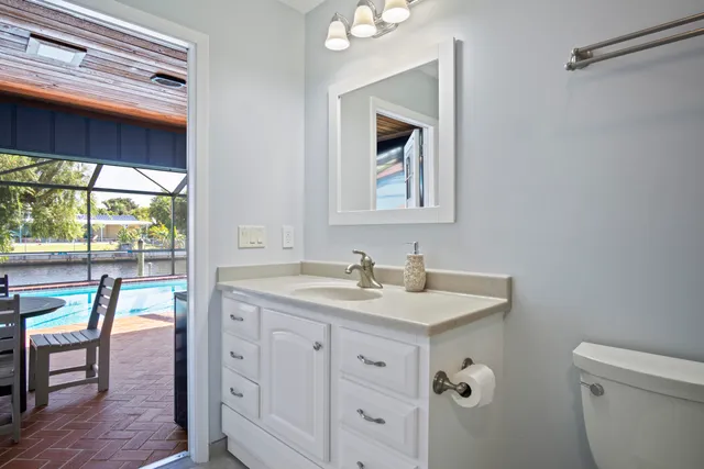 a view of a patio with a table and chairs