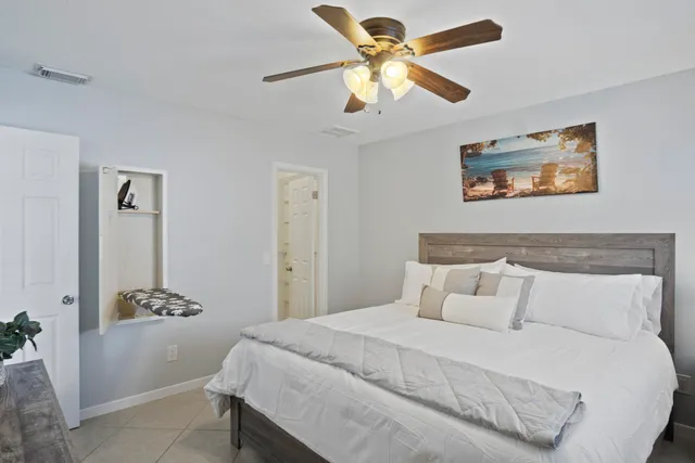 a view of a house with swimming pool and sitting area