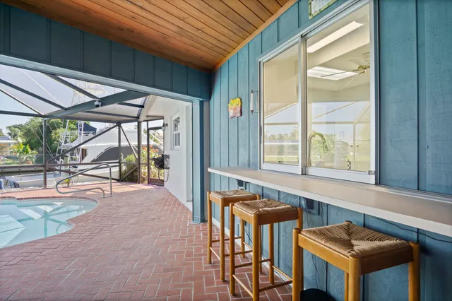 an aerial view of ocean with residential house with outdoor space