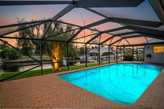 a view of a fountain in front of a house