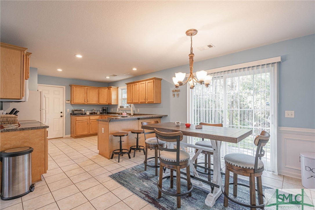 128 Ridgecrest Drive Rincon, GA 31326 - Photo 13 of 41 Dinning area and kitchen