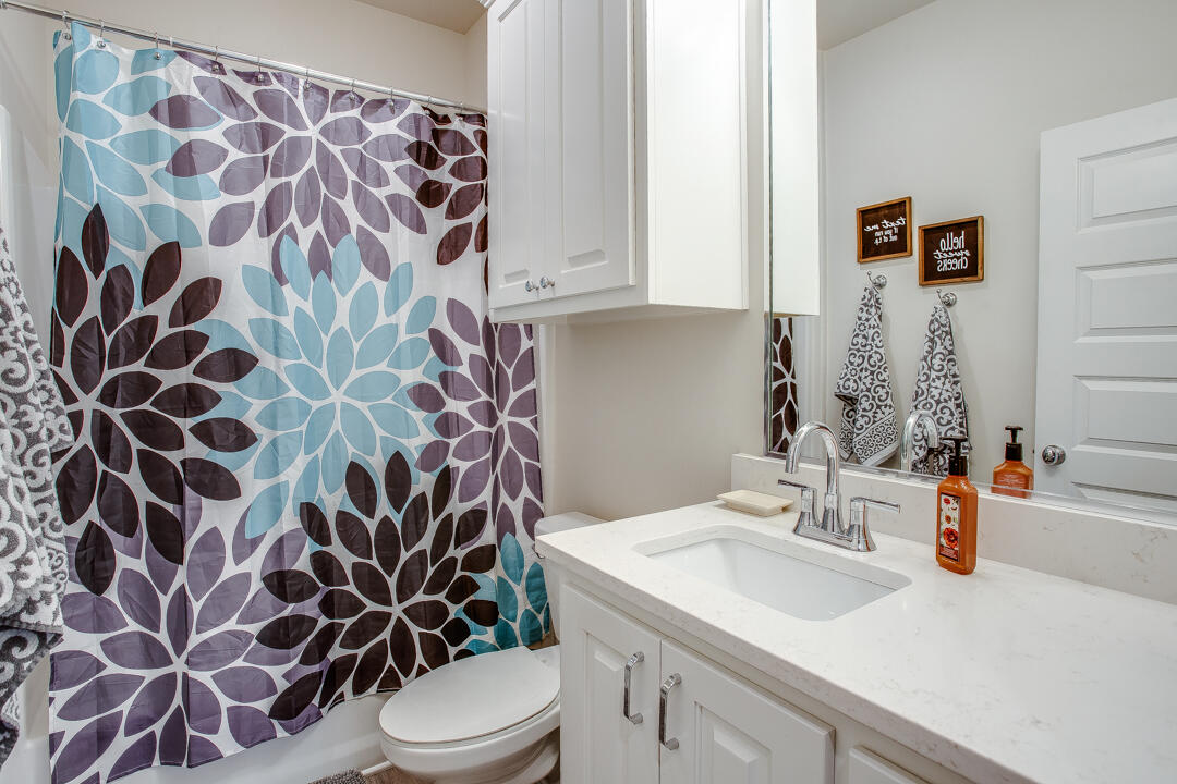 5701 119th Street Lubbock, TX 79424 - Photo 16 of 22 a bathroom with a sink toilet and shower