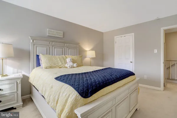 a bedroom with bed and window