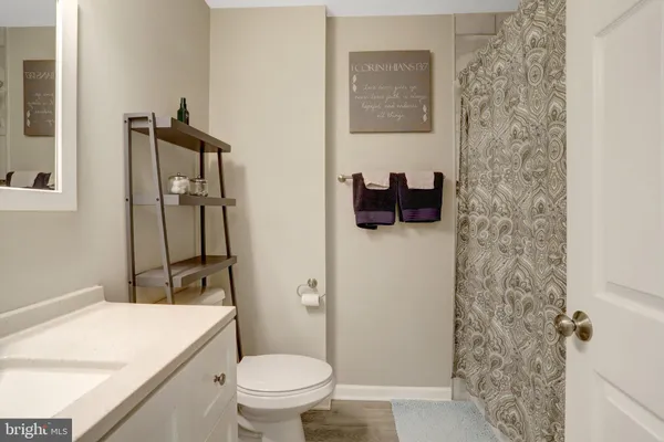 a bathroom with a toilet and a sink