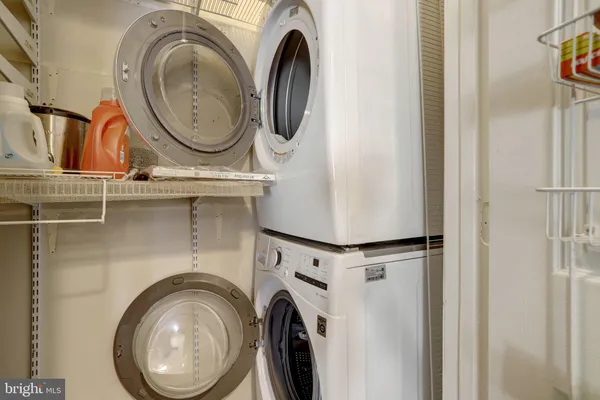 a view of storage and utility room with washer and dryer