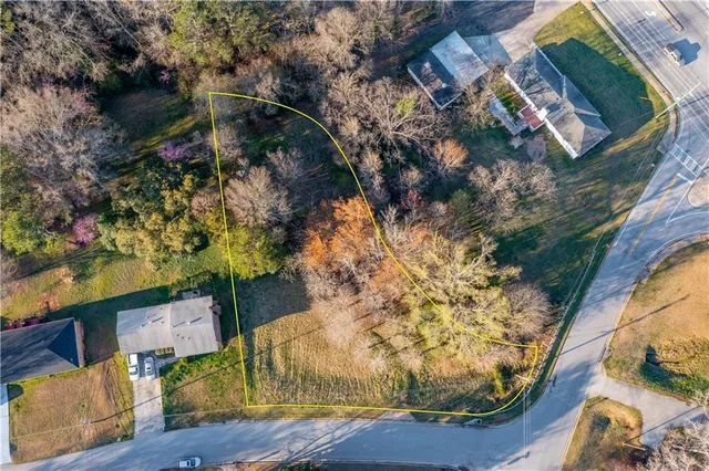 an aerial view of houses with yard
