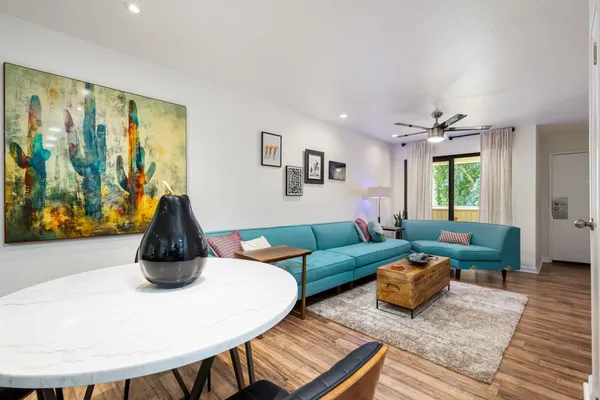 a living room with furniture and a large window