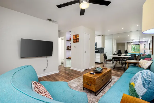 a living room with furniture and a flat screen tv