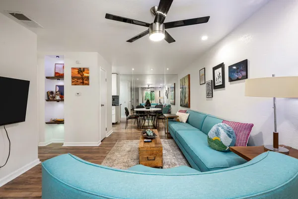 a living room with furniture and a flat screen tv