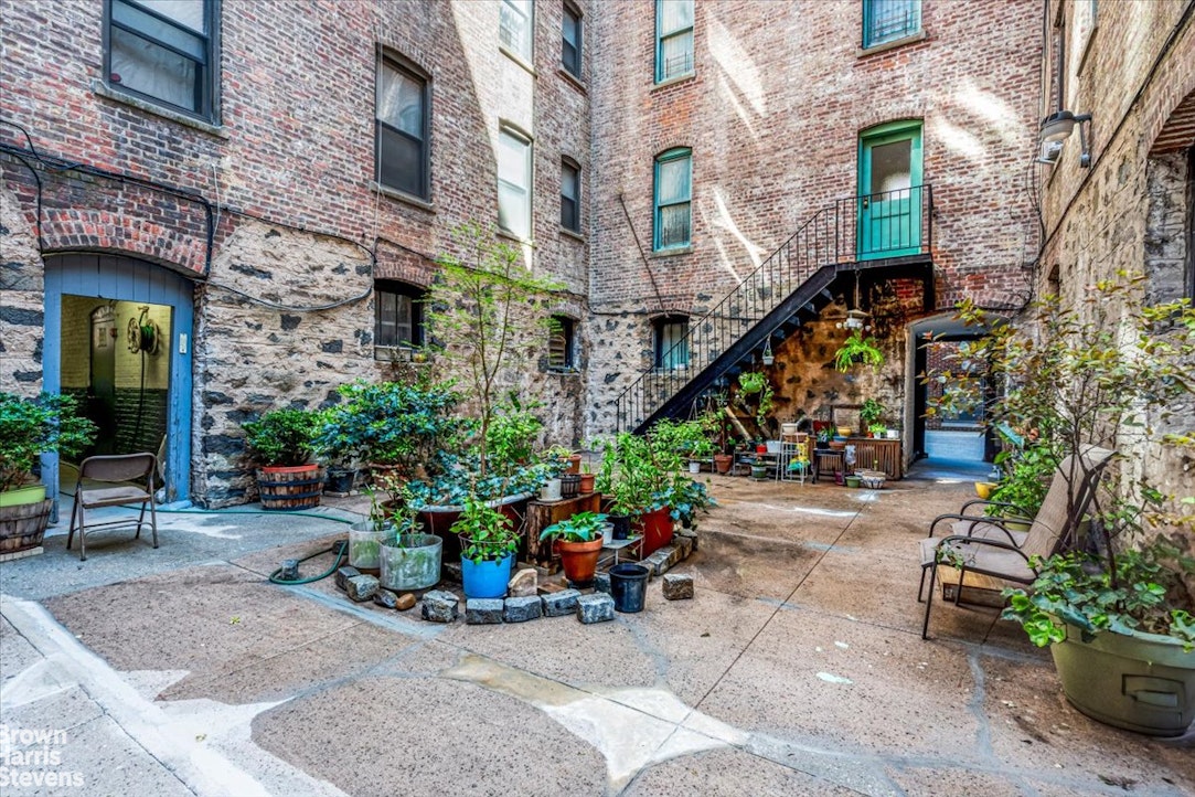 35-45 82nd Street, Unit 4 Queens, NY 11372 - Photo 11 of 15 a view of a brick building with plants