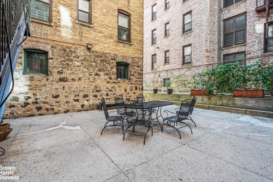 35-45 82nd Street, Unit 4 Queens, NY 11372 - Photo 12 of 15 a view of a patio with a table and chairs