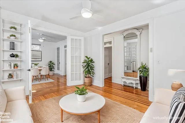 a living room with furniture and a table