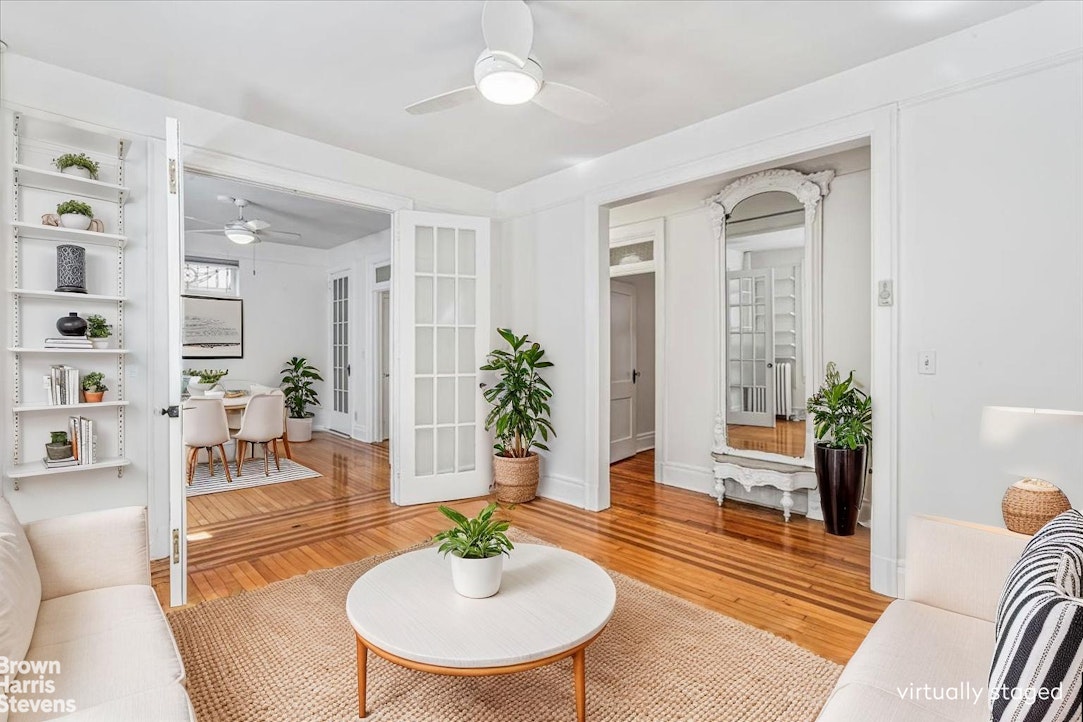 35-45 82nd Street, Unit 4 Queens, NY 11372 - Photo 2 of 15 a living room with furniture and a table