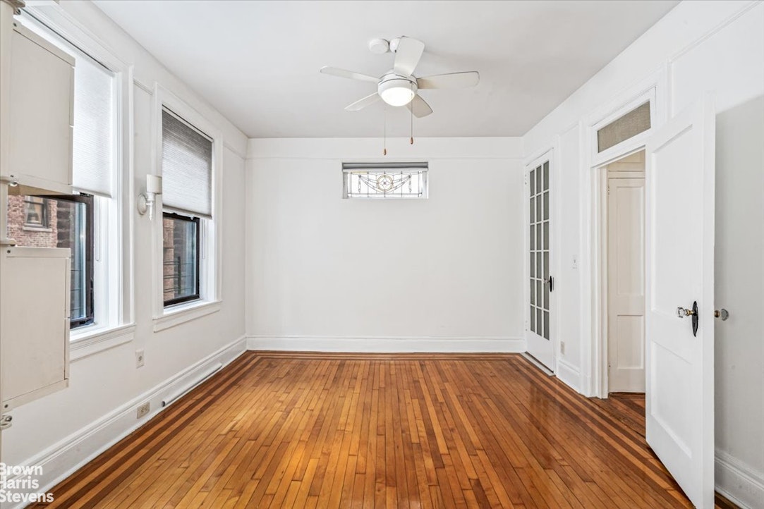 35-45 82nd Street, Unit 4 Queens, NY 11372 - Photo 4 of 15 wooden floor in an empty room with a window