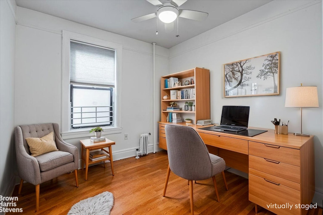 35-45 82nd Street, Unit 4 Queens, NY 11372 - Photo 7 of 15 a bedroom with a workspace