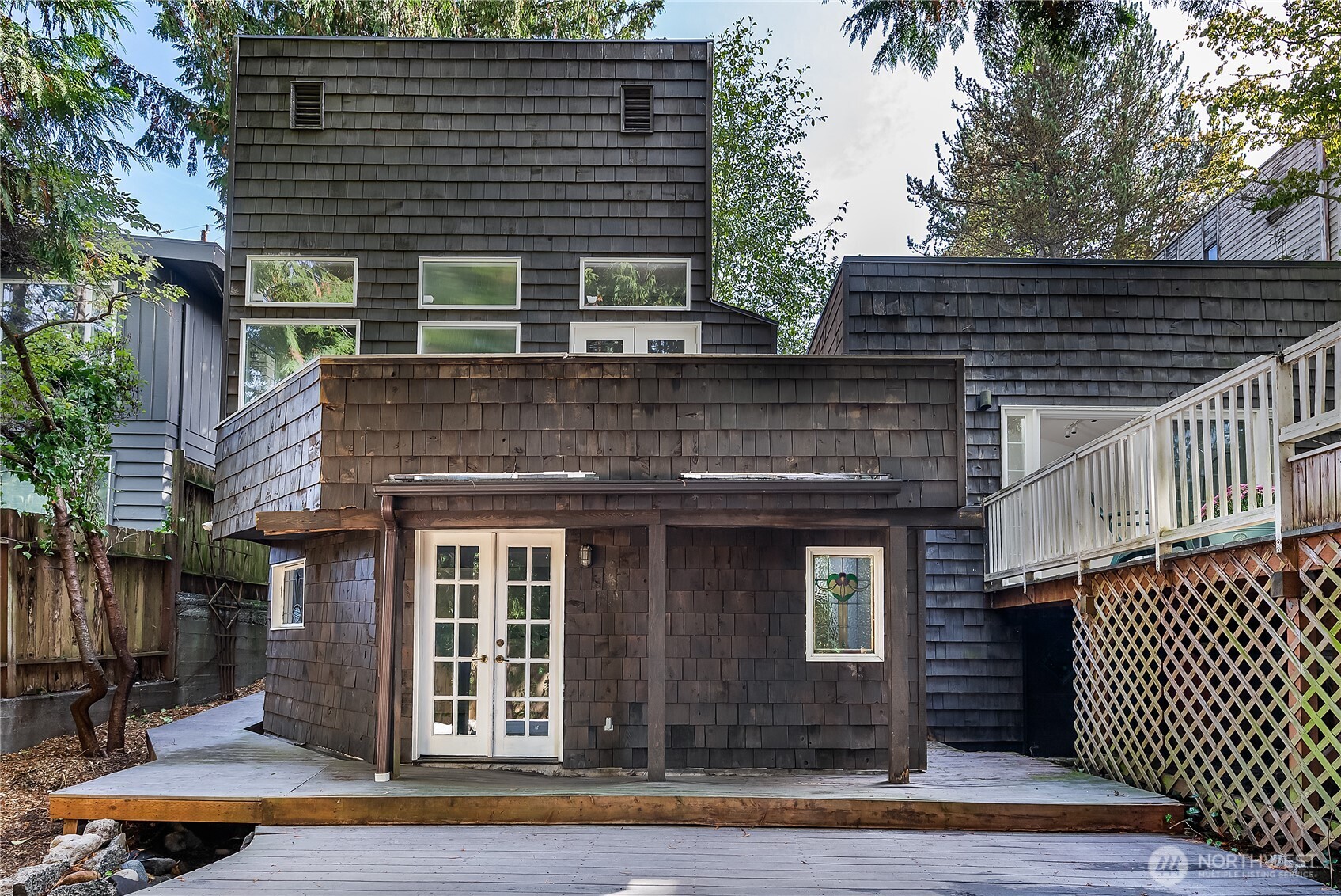 9521 25th Avenue Northwest Seattle, WA 98117 - Photo 25 of 29 a front view of a house with a garage