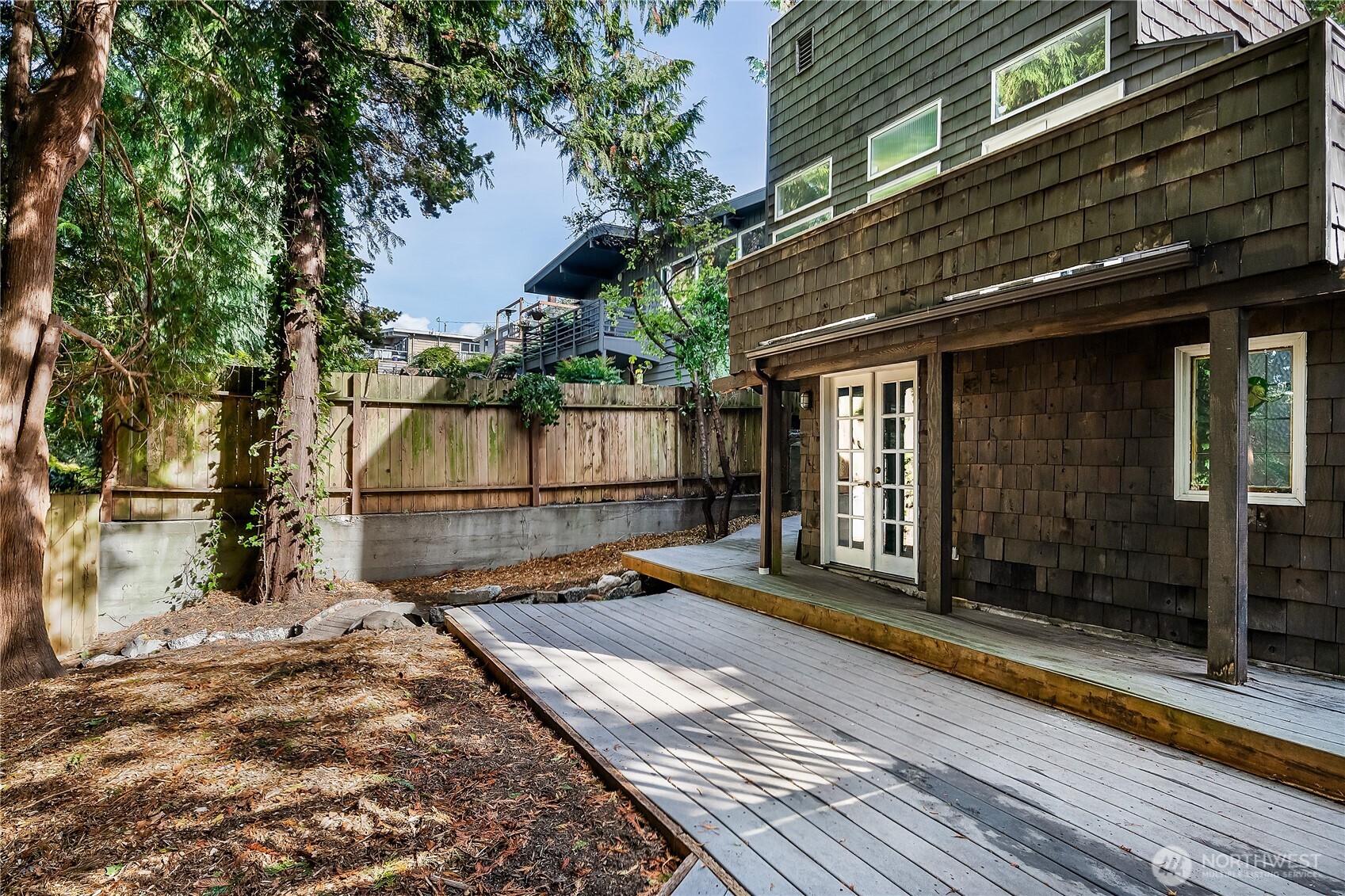 9521 25th Avenue Northwest Seattle, WA 98117 - Photo 27 of 29 a view of a brick house with a large window