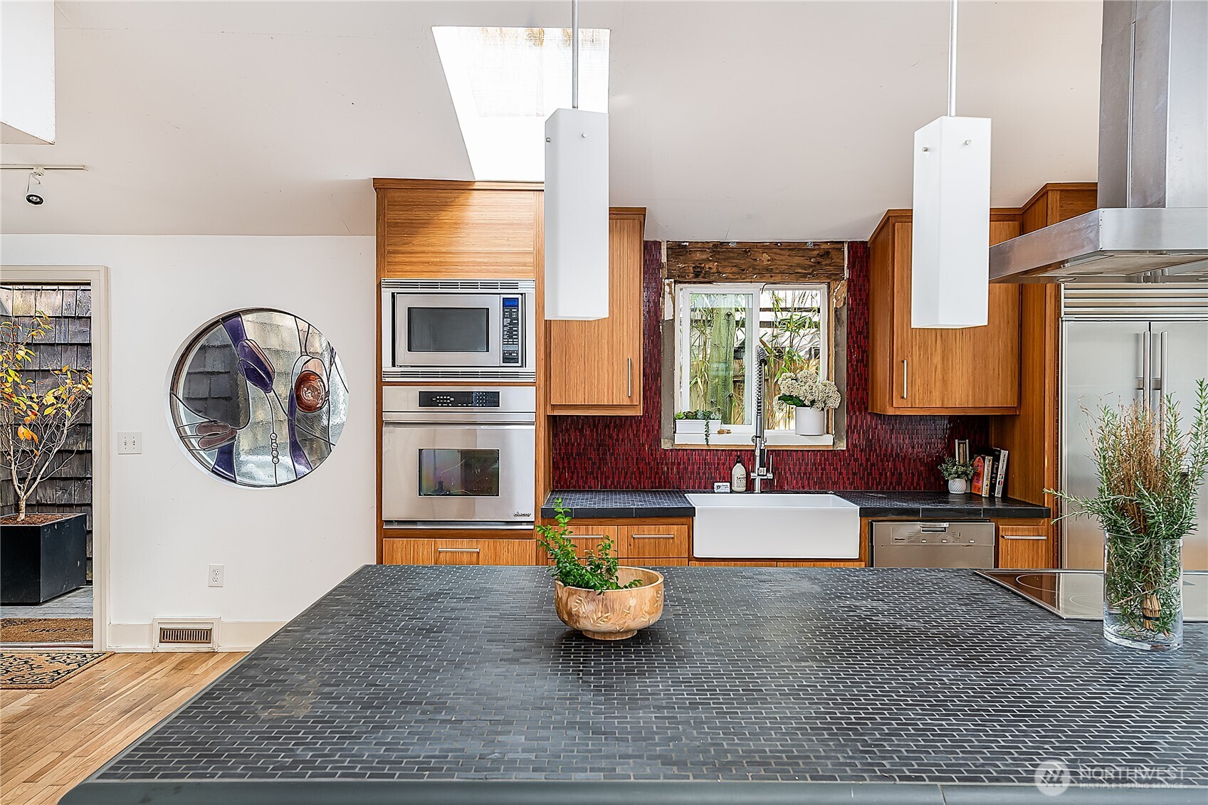 9521 25th Avenue Northwest Seattle, WA 98117 - Photo 4 of 29 a living room with fireplace furniture and a window