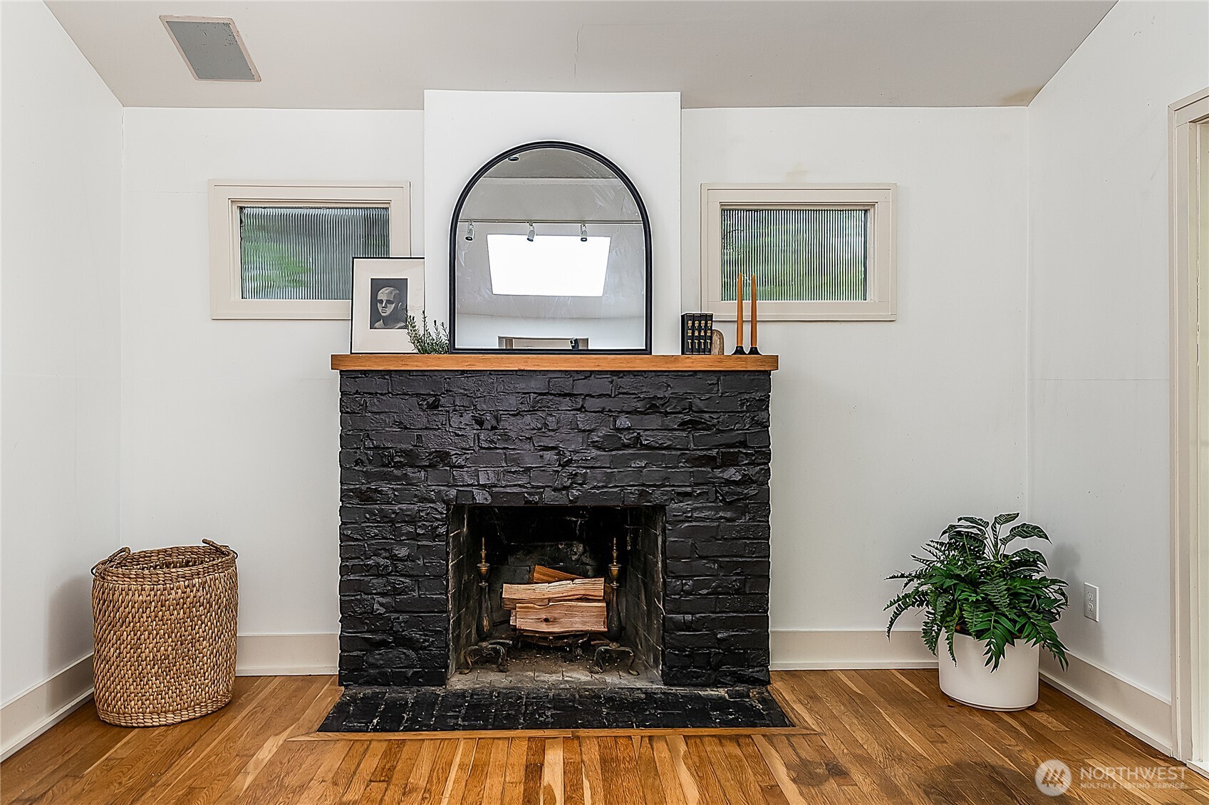 9521 25th Avenue Northwest Seattle, WA 98117 - Photo 10 of 29 a living room with furniture and a fireplace