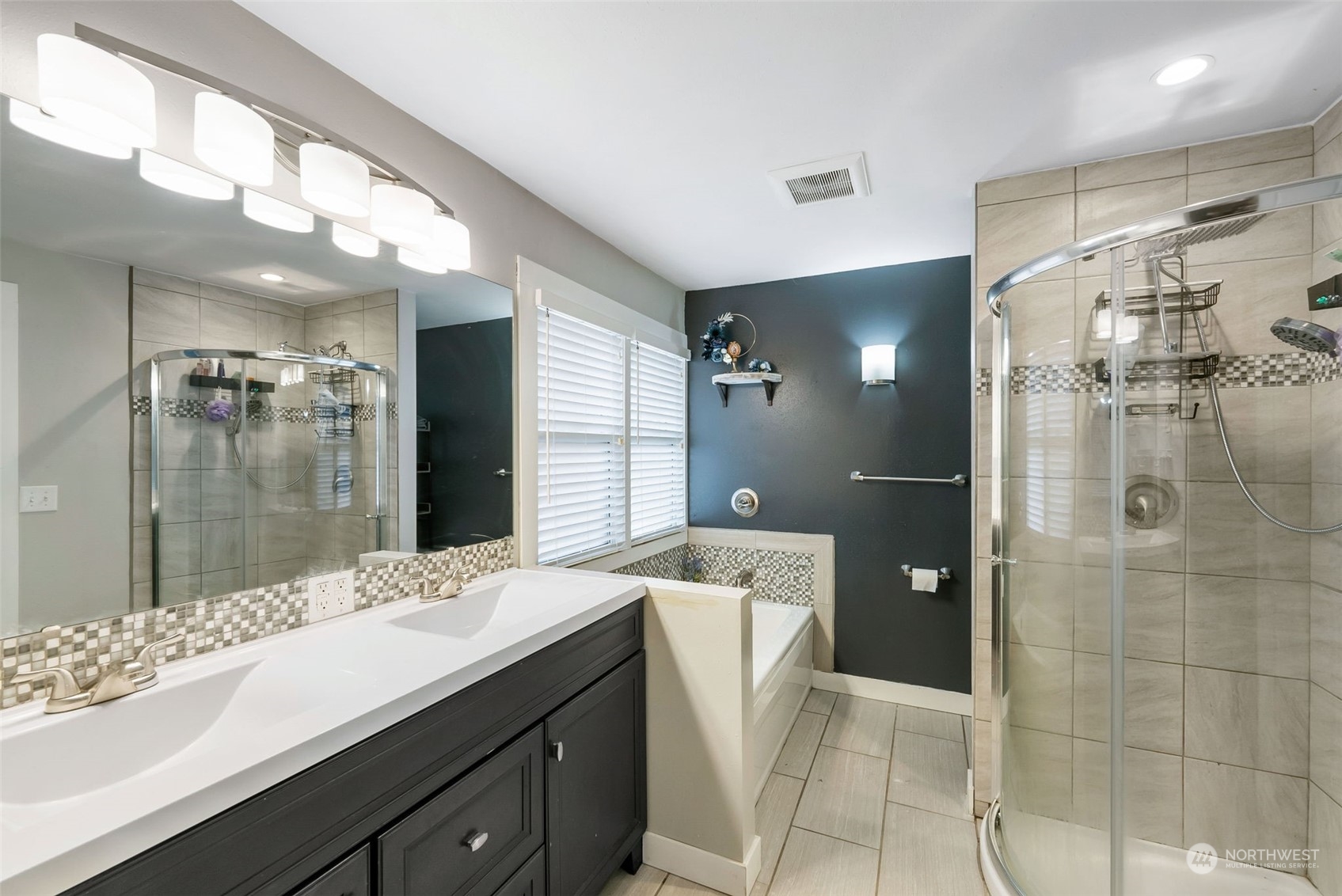 2711 Maple Street Bremerton, WA 98310 - Photo 14 of 23 a bathroom with a sink mirror and shower