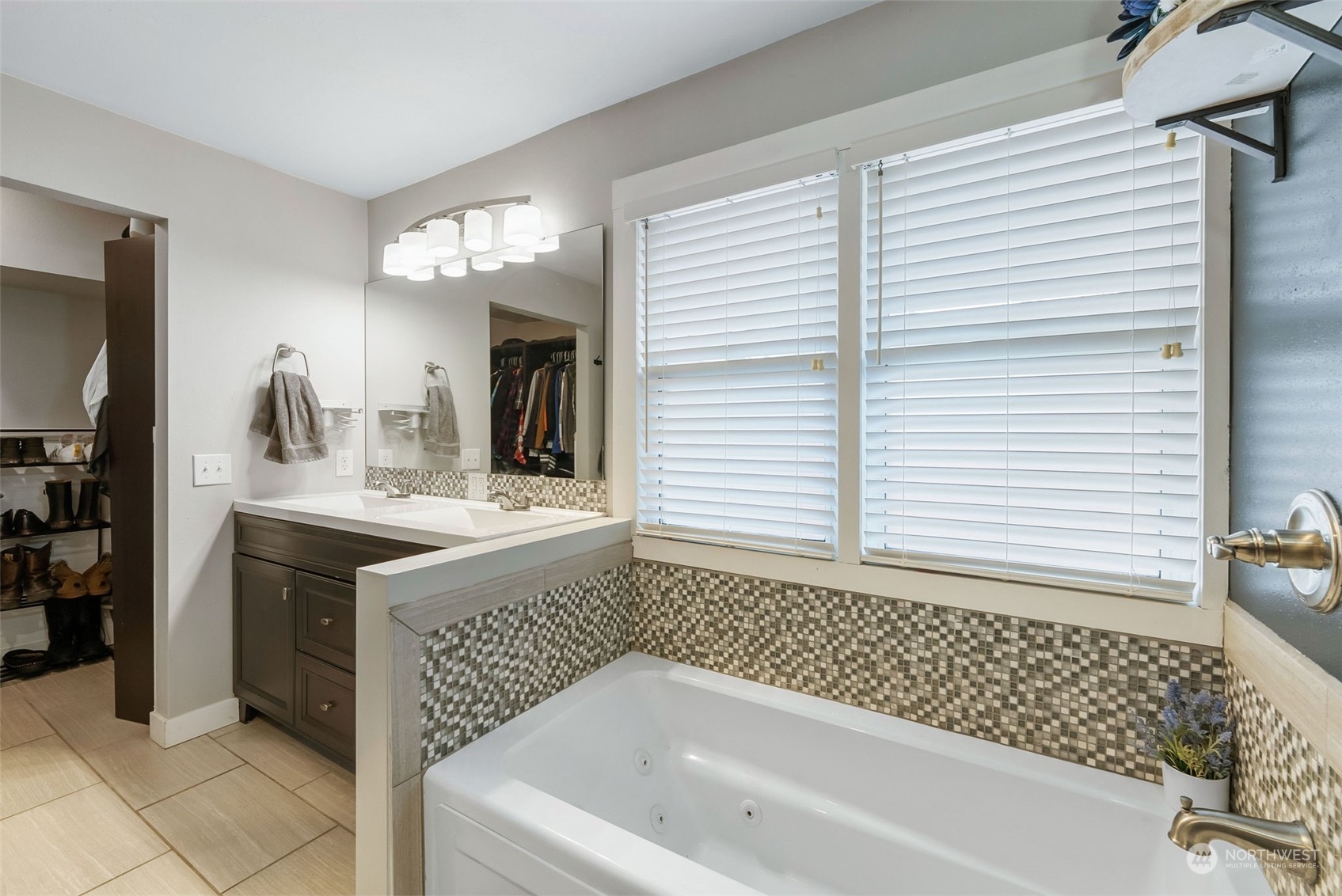 2711 Maple Street Bremerton, WA 98310 - Photo 15 of 23 a bathroom with a bathtub sink and mirror
