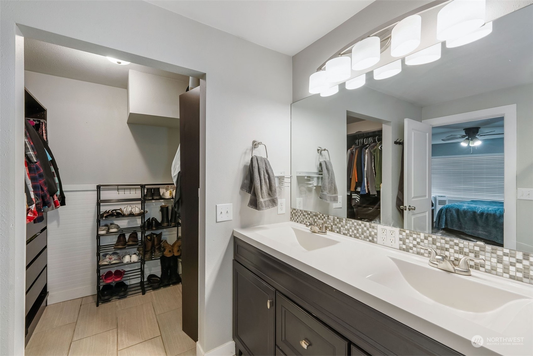 2711 Maple Street Bremerton, WA 98310 - Photo 16 of 23 a bathroom with a double vanity sink and a mirror