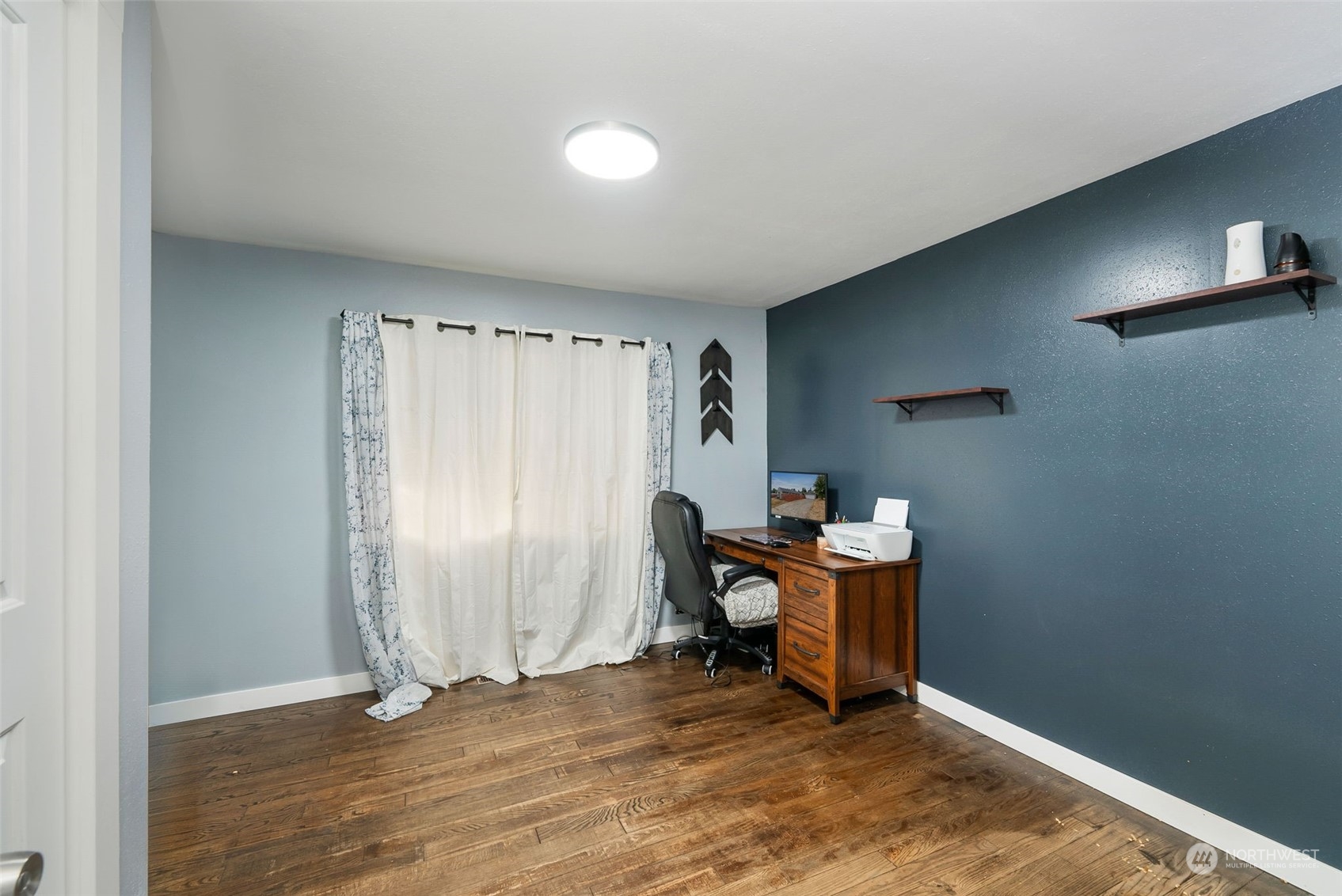 2711 Maple Street Bremerton, WA 98310 - Photo 17 of 23 a view of a workspace with furniture and a window