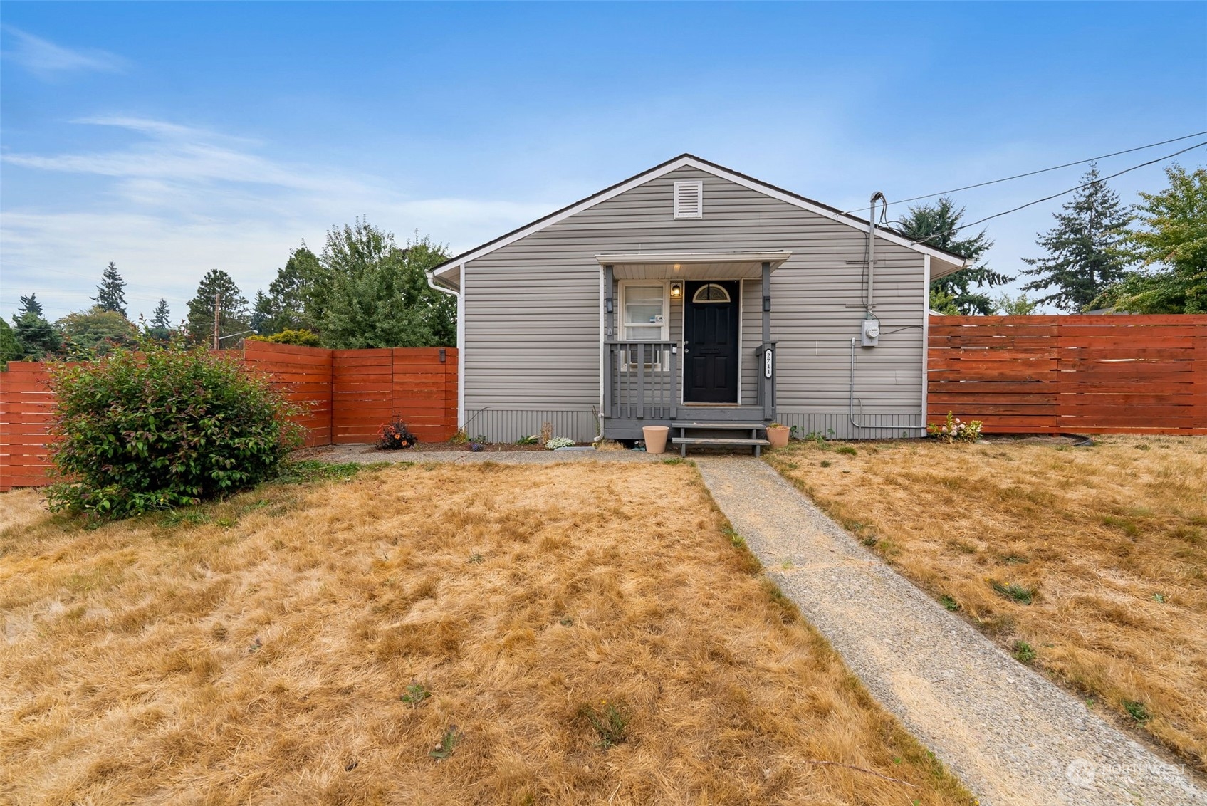2711 Maple Street Bremerton, WA 98310 - Photo 2 of 23 a front view of a house with a yard