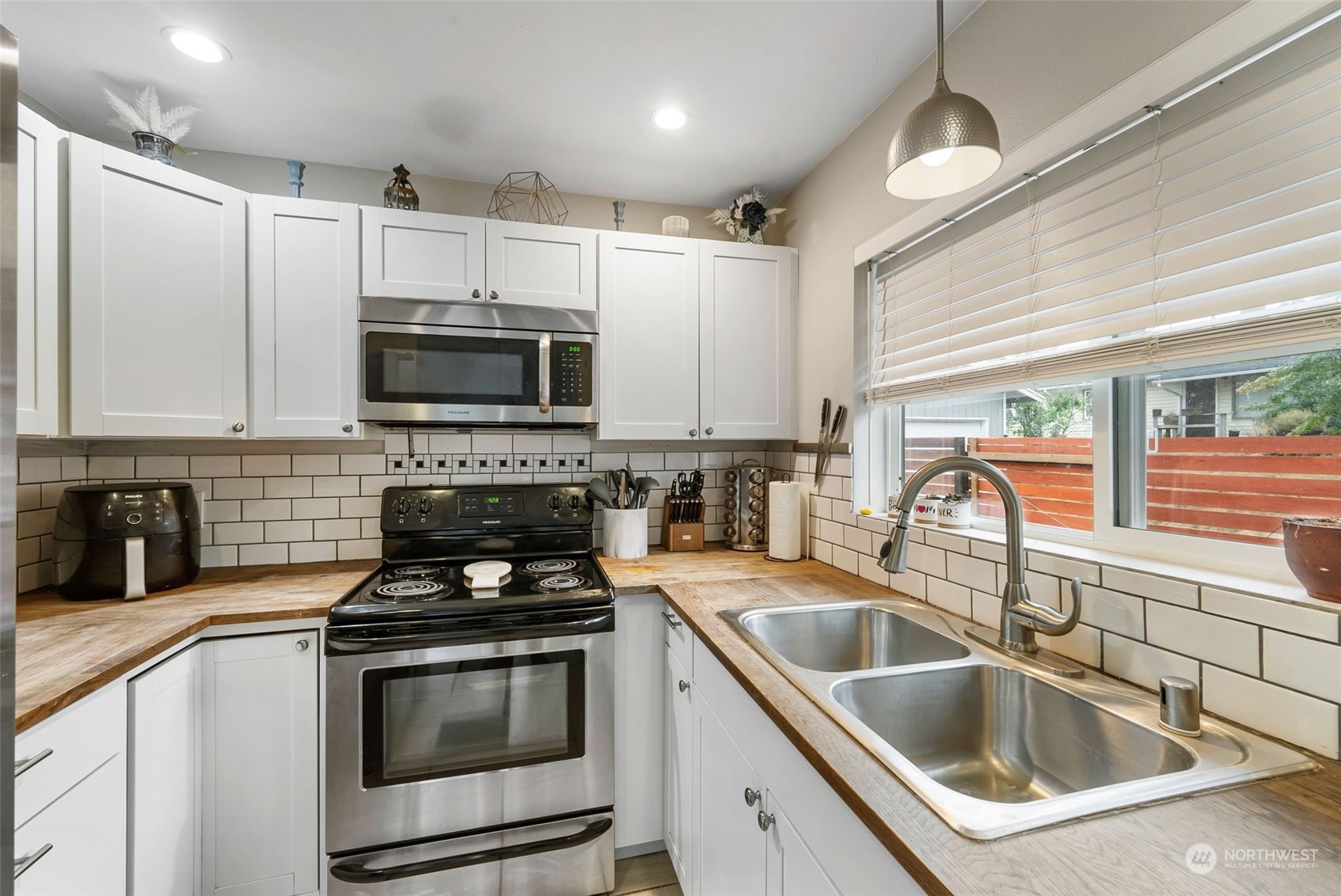 2711 Maple Street Bremerton, WA 98310 - Photo 10 of 23 a kitchen that has a sink and a stove