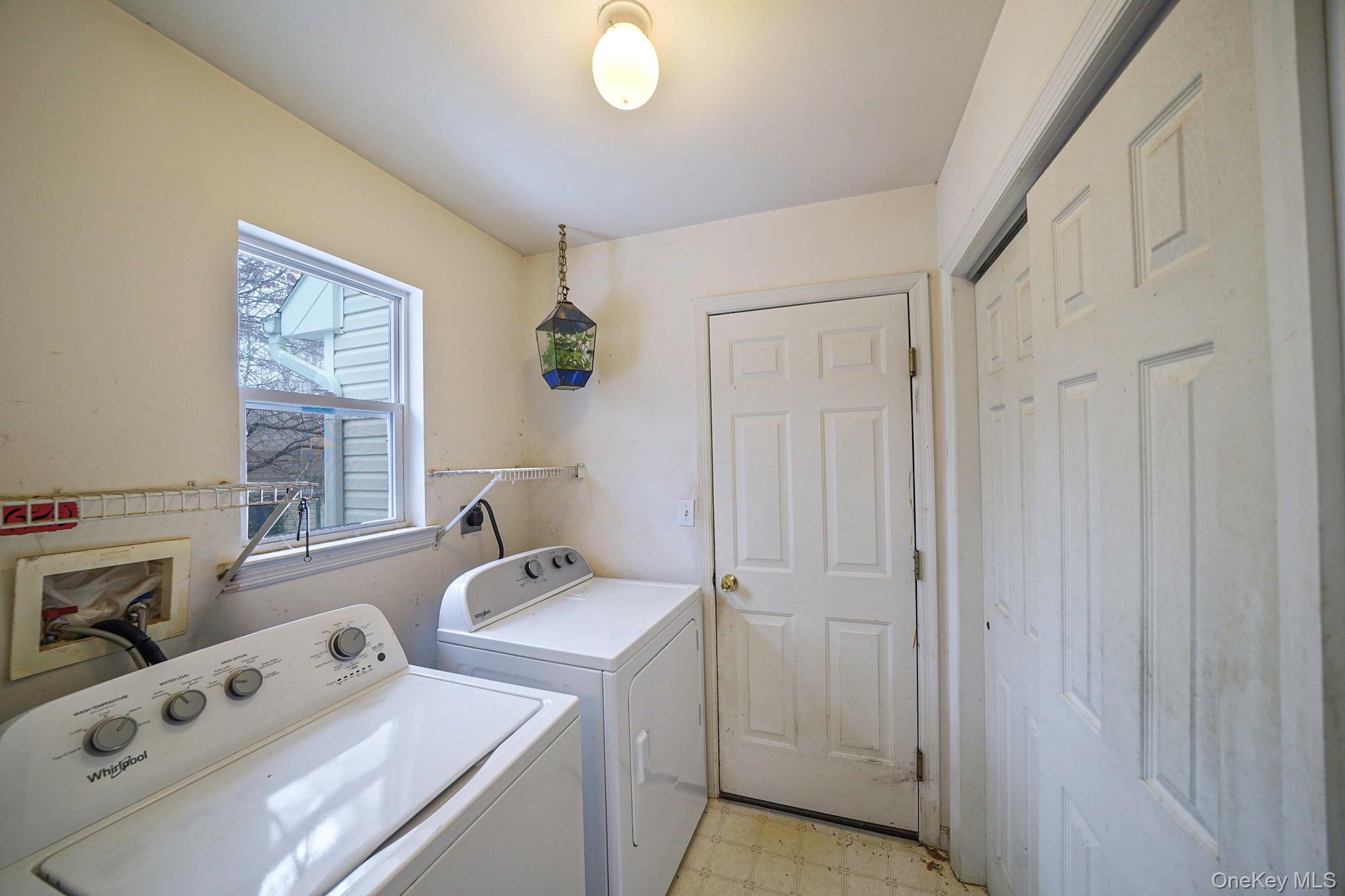 22 Wright Road Manorville, NY 11949 - Photo 18 of 47 a view of utility room with washer and dryer