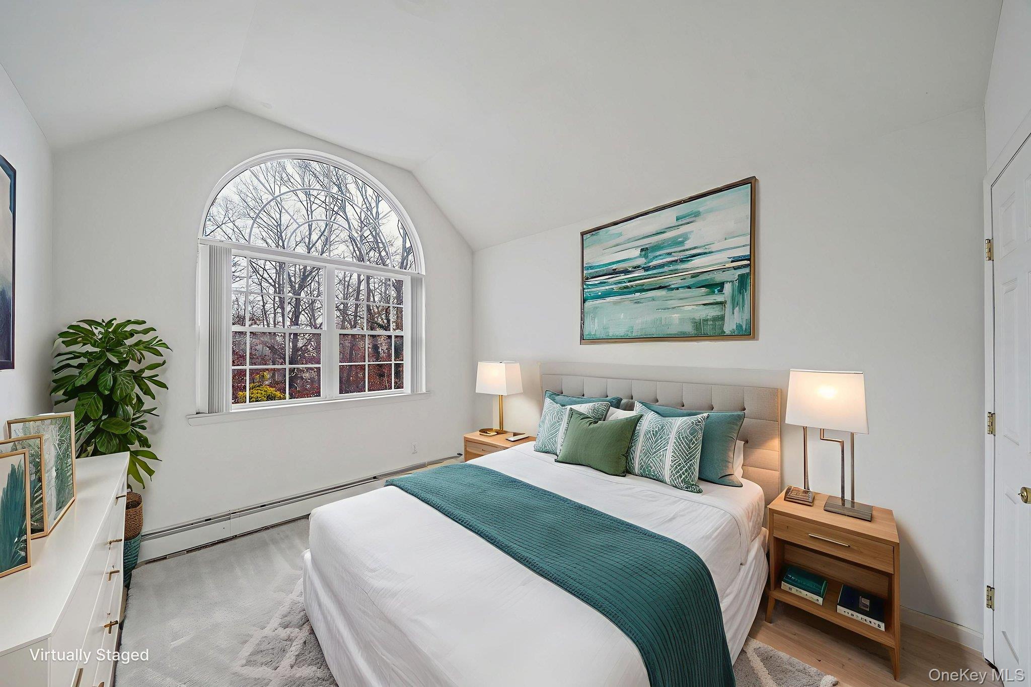 22 Wright Road Manorville, NY 11949 - Photo 21 of 47 a bedroom with a bed and a painting on the wall