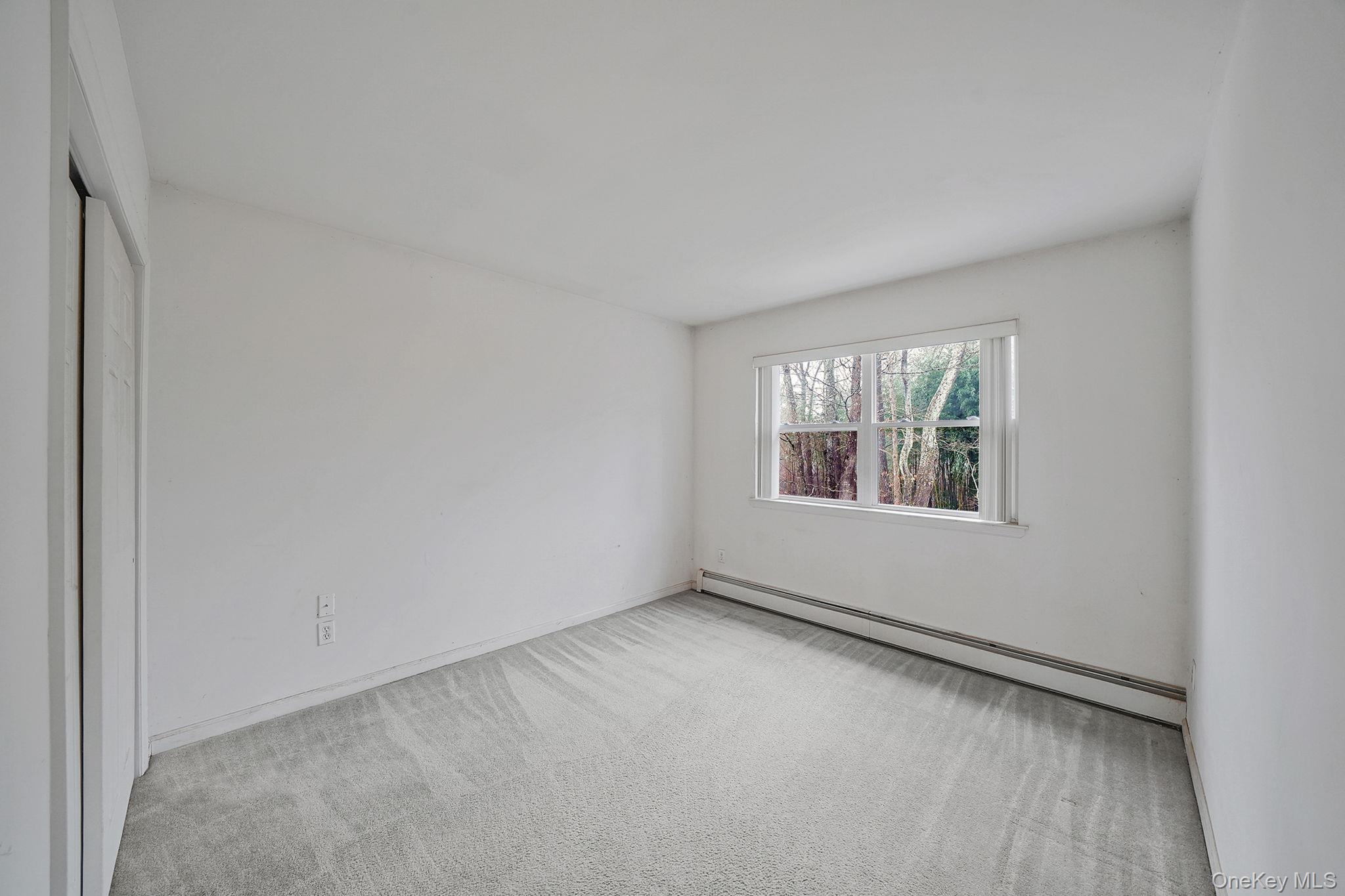 22 Wright Road Manorville, NY 11949 - Photo 23 of 47 an empty room with windows