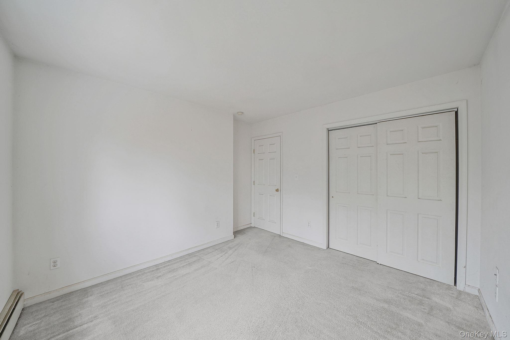 22 Wright Road Manorville, NY 11949 - Photo 24 of 47 a view of an empty room and entryway