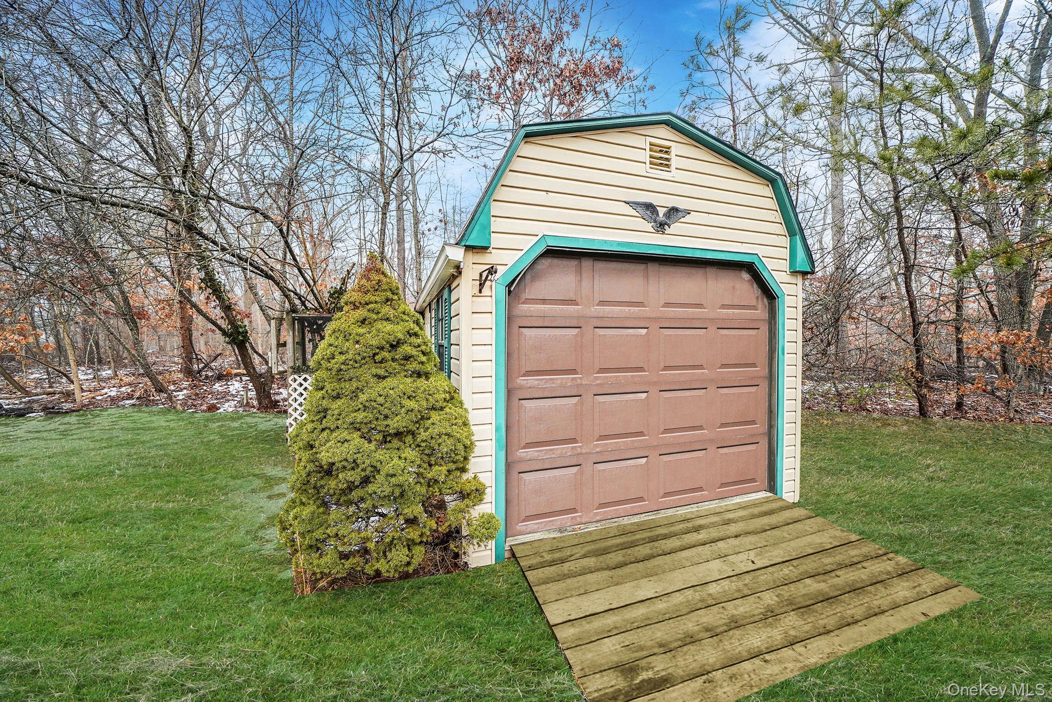 22 Wright Road Manorville, NY 11949 - Photo 40 of 47 a view of a pathway of house