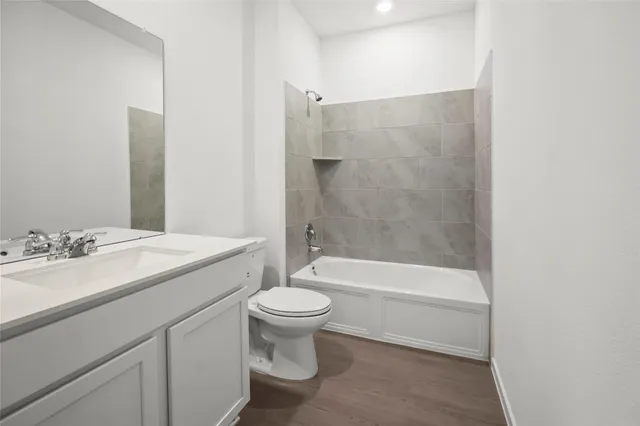 a bathroom with a sink a toilet and a bathtub