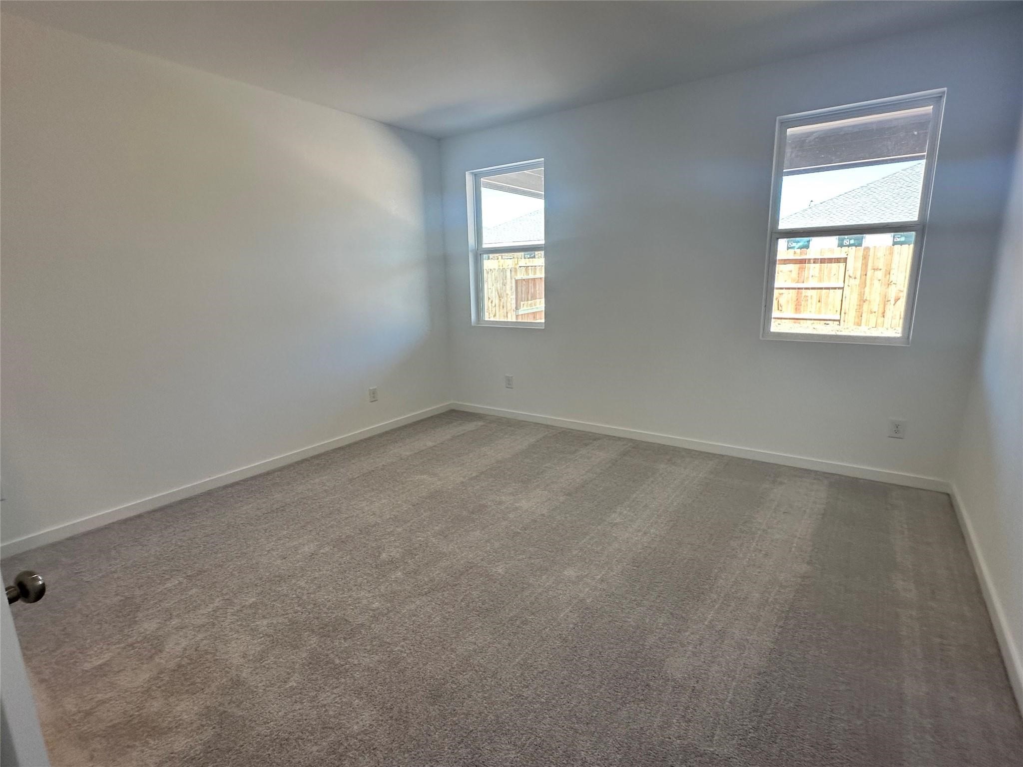 8310 Opal Pond Drive Angleton, TX 77515 - Photo 6 of 22 an empty room with a window
