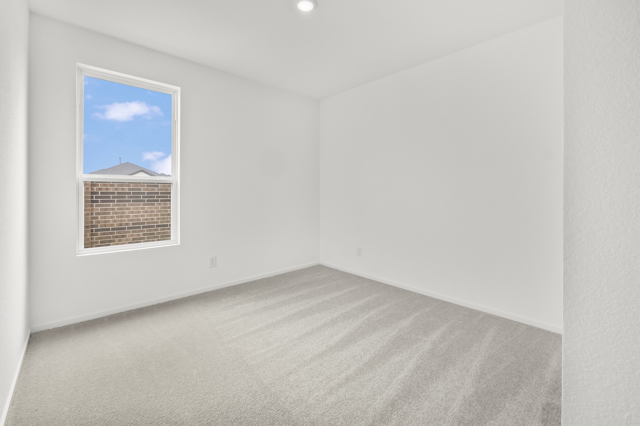 8310 Opal Pond Drive Angleton, TX 77515 - Photo 9 of 22 an empty room with a window