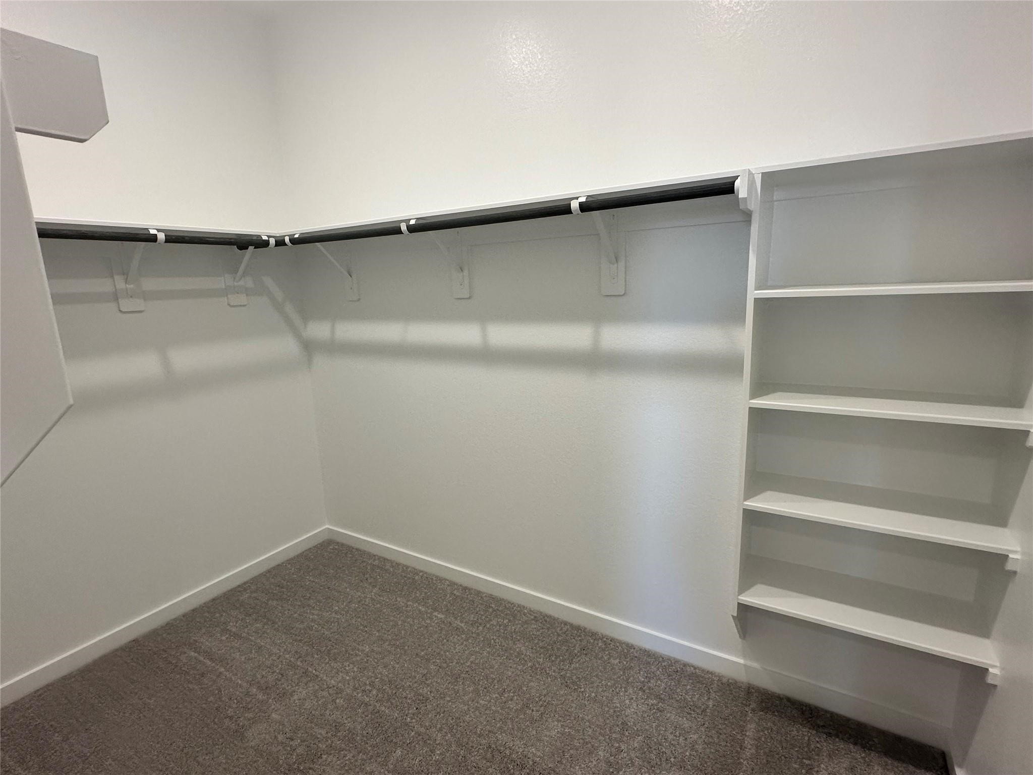 8310 Opal Pond Drive Angleton, TX 77515 - Photo 10 of 22 a view of an empty walk in closet