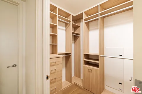 a spacious bathroom with a double vanity sink mirror and a