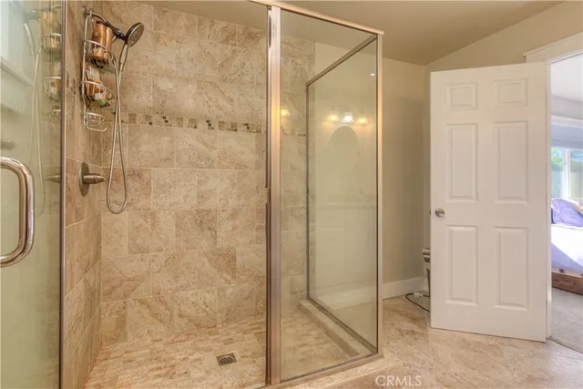 a bedroom with bed and window