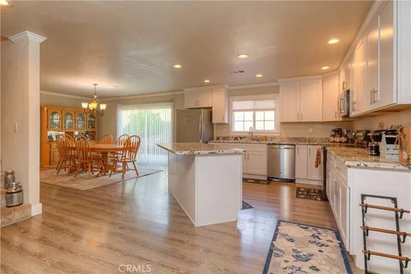 a large open kitchen with a table and chairs