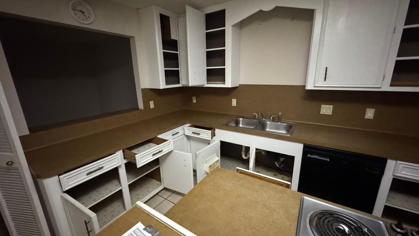 2162 Paso Rello Drive Houston, TX 77077 - Photo 11 of 32 a kitchen with a sink cabinets and utility
